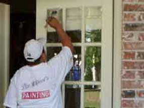 Painter Painting a Door