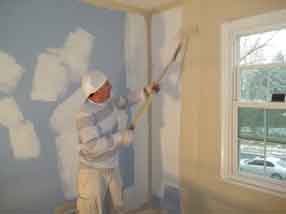 Painter Rolling a Wall